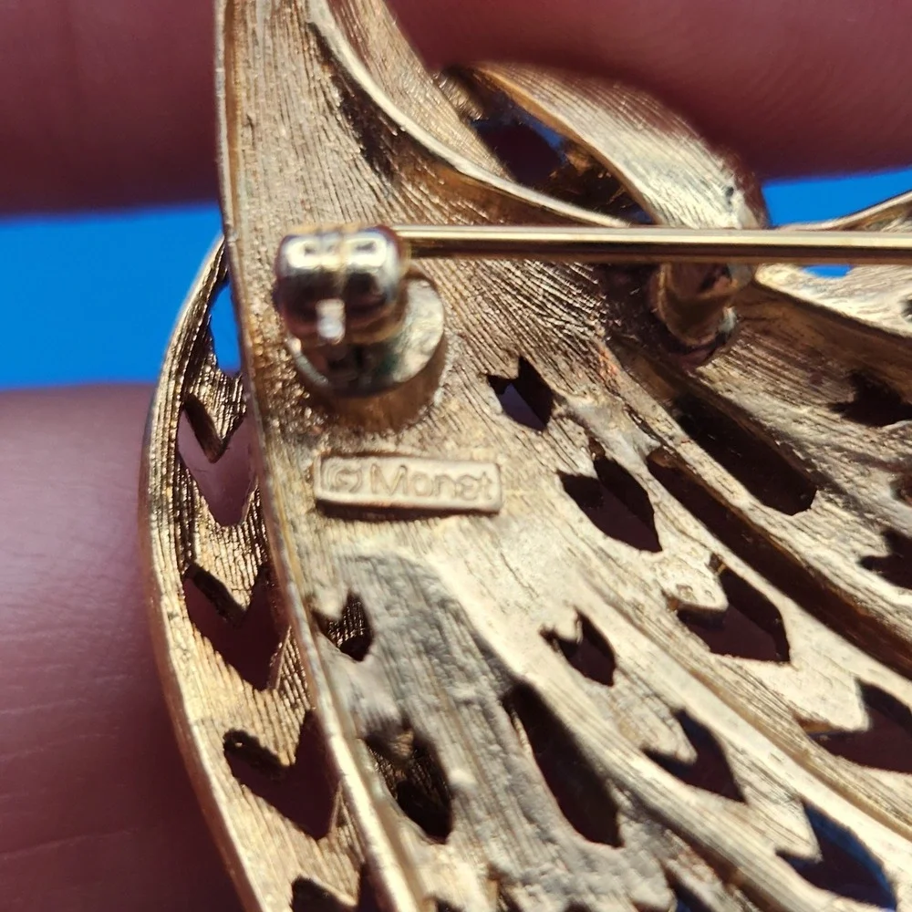 Vintage Monet Gold Tone Abstract Spray Brooch Textured Openwork Wing Pin
